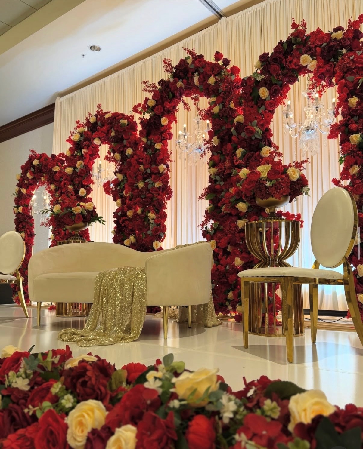 Candlelit banquet table styled with ivory florals at a Martha Naseem Creations wedding